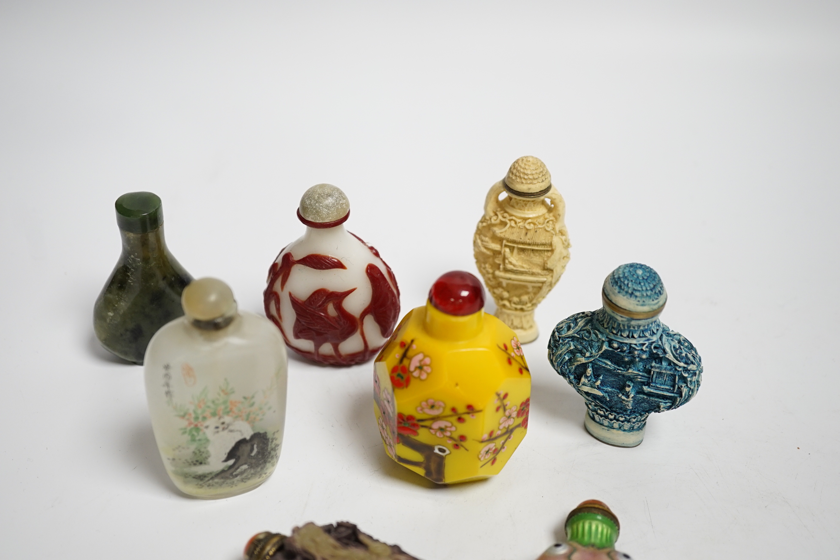 Seven various Chinese snuff bottles to include enamel, resin, agate, ceramic and glass